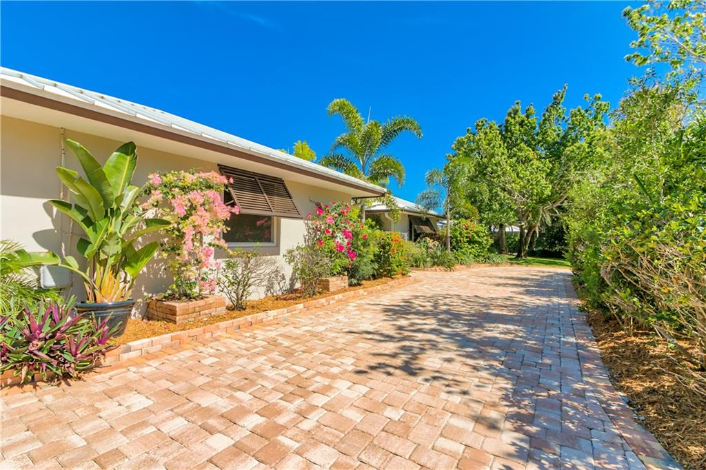 132 South Sewalls Point Road Stuart, FL 34996 - Photo 22 of 31 a front view of a house with a yard