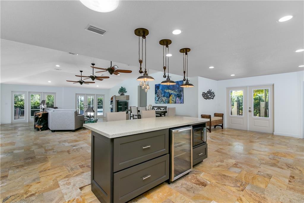 132 South Sewalls Point Road Stuart, FL 34996 - Photo 6 of 31 a kitchen with sink stove and cabinets