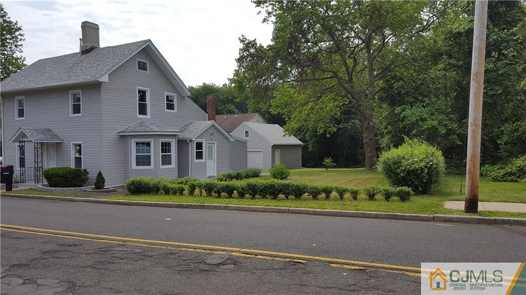 87 County Road Cliffwood, NJ 07721 - Photo 1 of 25 a front view of a house with a garden