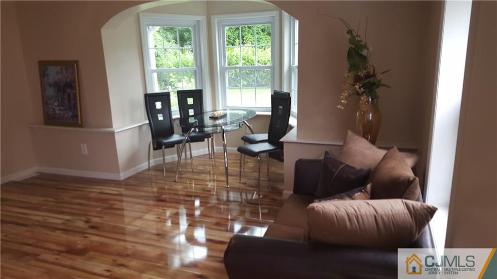 87 County Road Cliffwood, NJ 07721 - Photo 2 of 25 a living room with furniture and a large window