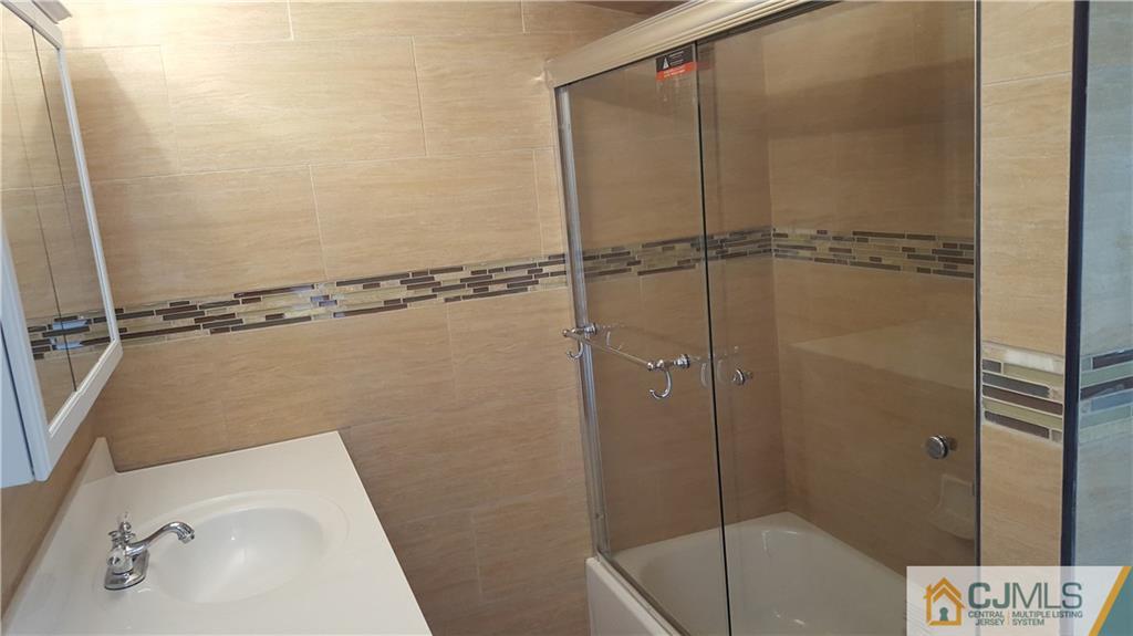 87 County Road Cliffwood, NJ 07721 - Photo 13 of 25 a bathroom with a sink and shower