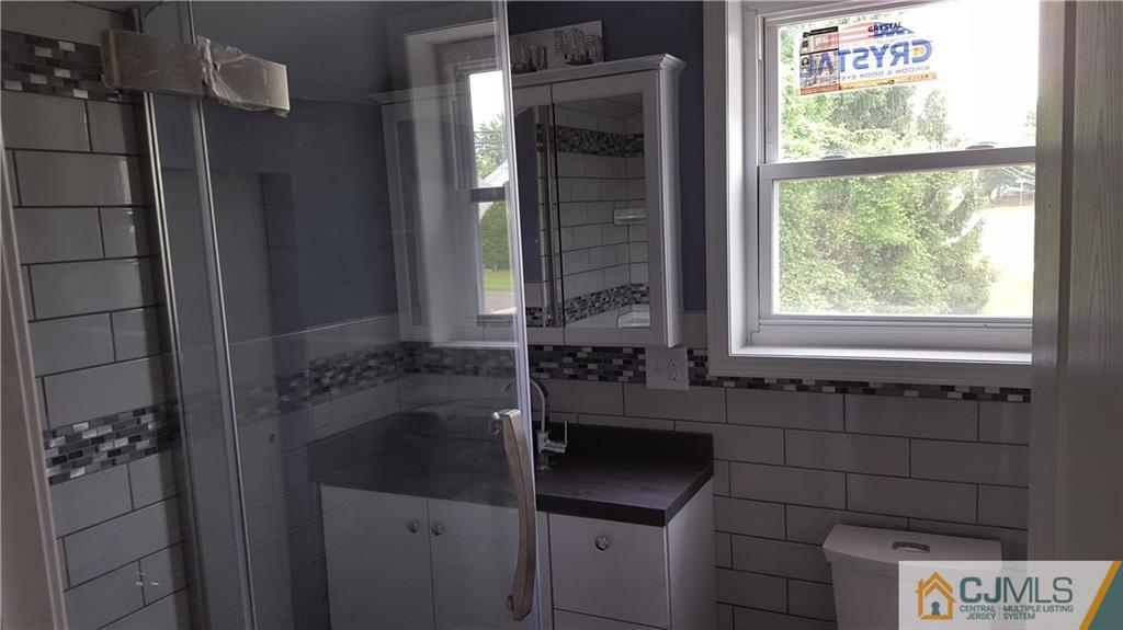 87 County Road Cliffwood, NJ 07721 - Photo 17 of 25 a bathroom with a bathtub and shower