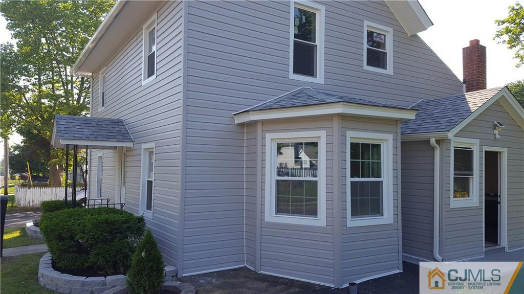 87 County Road Cliffwood, NJ 07721 - Photo 19 of 25 a front view of a house with a garden
