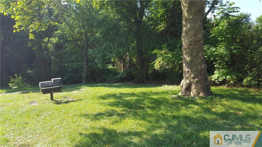 87 County Road Cliffwood, NJ 07721 - Photo 20 of 25 a backyard of a house with table and chairs