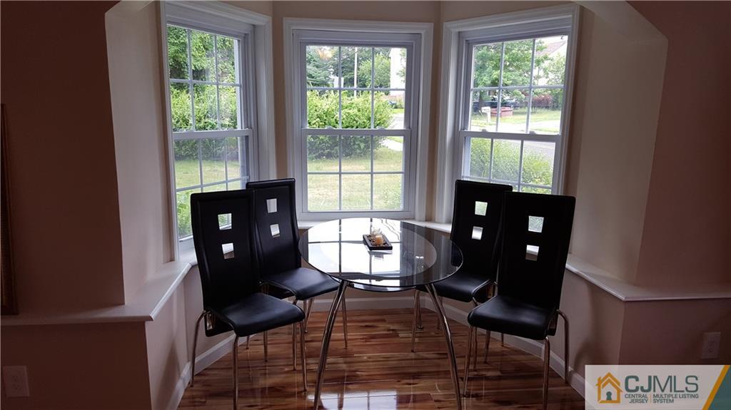 87 County Road Cliffwood, NJ 07721 - Photo 4 of 25 a living room with furniture and a floor to ceiling window