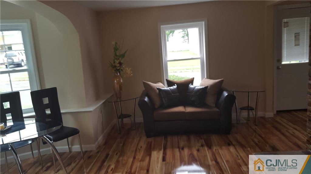 87 County Road Cliffwood, NJ 07721 - Photo 5 of 25 a living room with furniture and a window