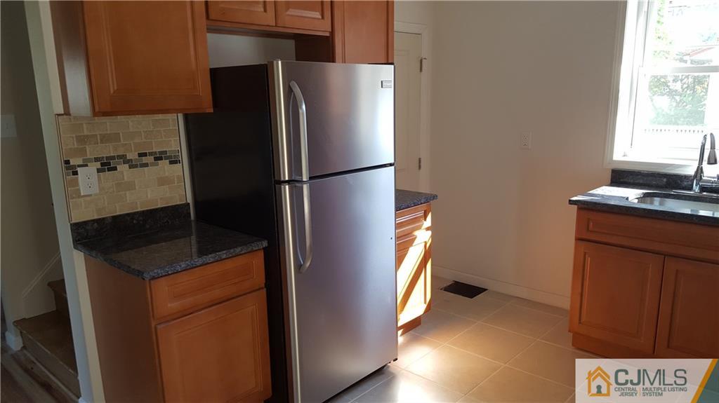 87 County Road Cliffwood, NJ 07721 - Photo 7 of 25 a kitchen with stainless steel appliances granite countertop a refrigerator and a sink
