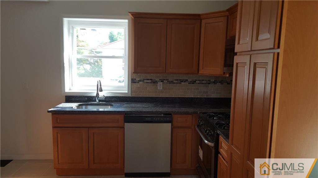 87 County Road Cliffwood, NJ 07721 - Photo 8 of 25 a kitchen with a sink and cabinets