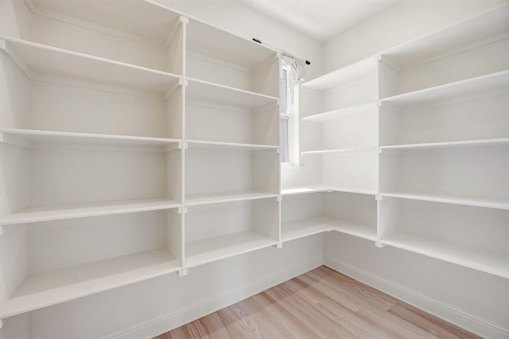 445 Rodeo Way Stephenville, TX 76401 - Photo 11 of 40 a view of walk in closet with empty racks