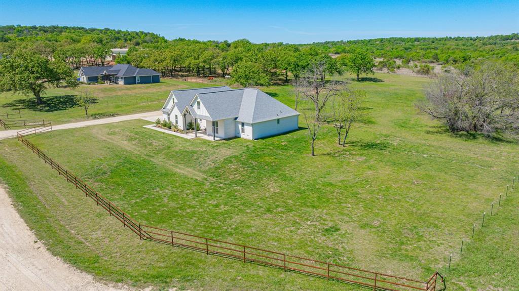 445 Rodeo Way Stephenville, TX 76401 - Photo 37 of 40 a view of a lake with a yard