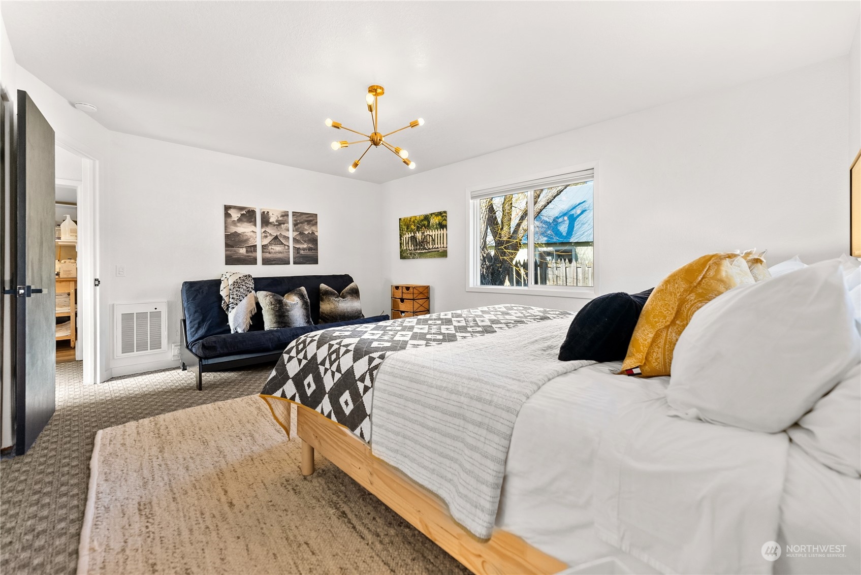 238 Castle Avenue Winthrop, WA 98862 - Photo 17 of 40 a bedroom with a bed and wooden floor