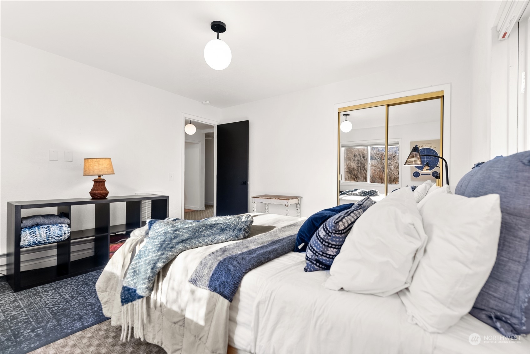 238 Castle Avenue Winthrop, WA 98862 - Photo 20 of 40 a bedroom with a bed and wooden floor