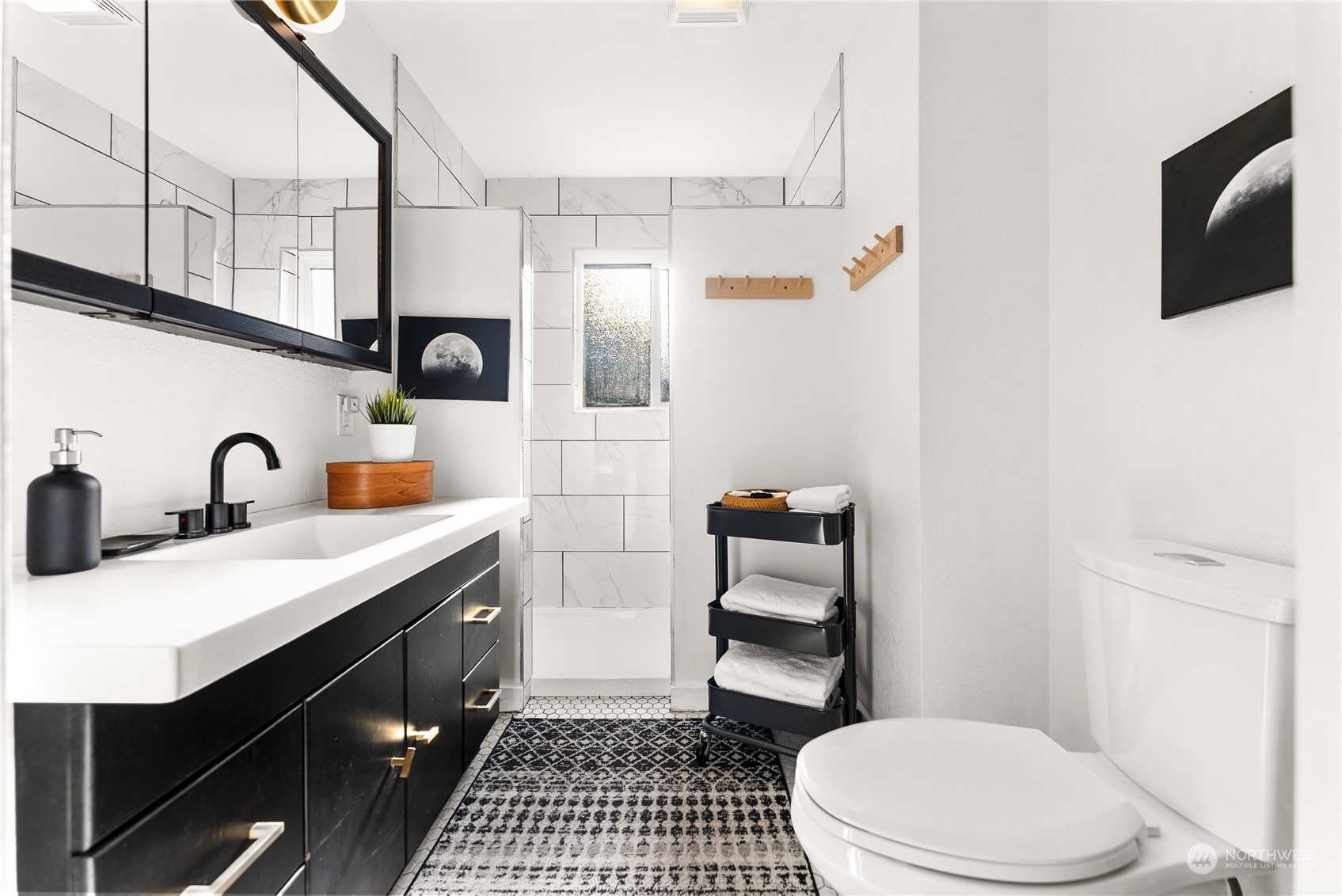 238 Castle Avenue Winthrop, WA 98862 - Photo 23 of 40 a bathroom with a sink a toilet a mirror and shower