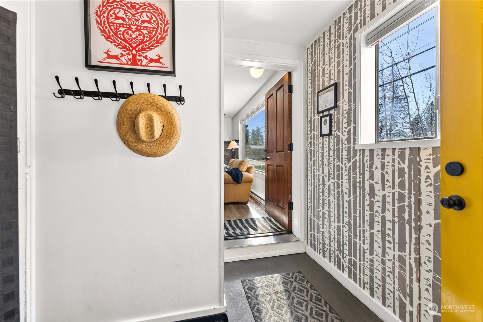 238 Castle Avenue Winthrop, WA 98862 - Photo 3 of 40 a view of a hallway with wooden floor and a bathroom