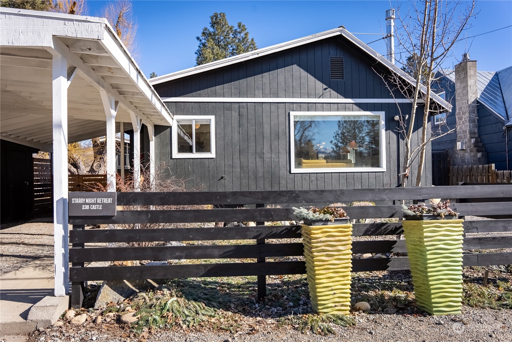 238 Castle Avenue Winthrop, WA 98862 - Photo 33 of 40 a front view of a house with plants