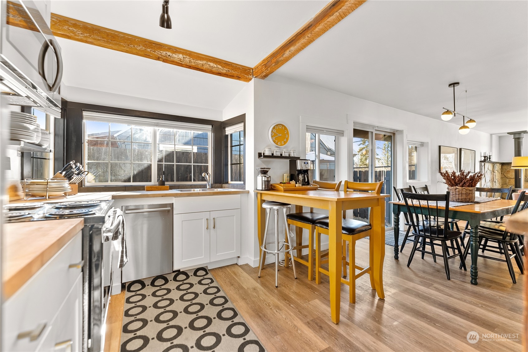238 Castle Avenue Winthrop, WA 98862 - Photo 10 of 40 a kitchen with stainless steel appliances kitchen island granite countertop a sink and cabinets