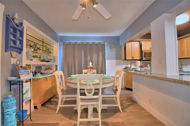 a dining room with furniture and window