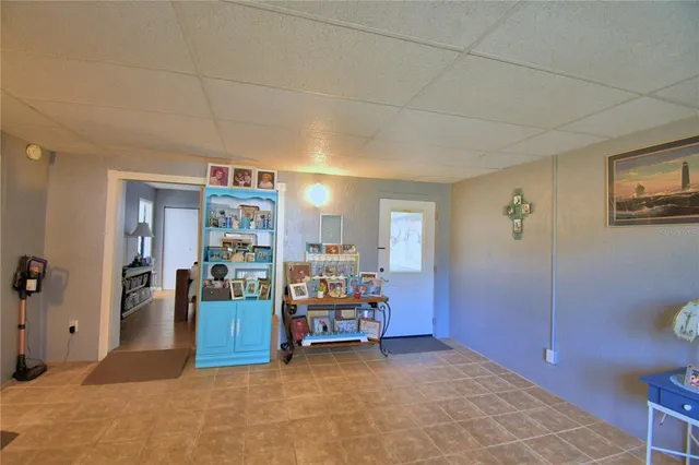 a view of a livingroom with furniture and cabinet