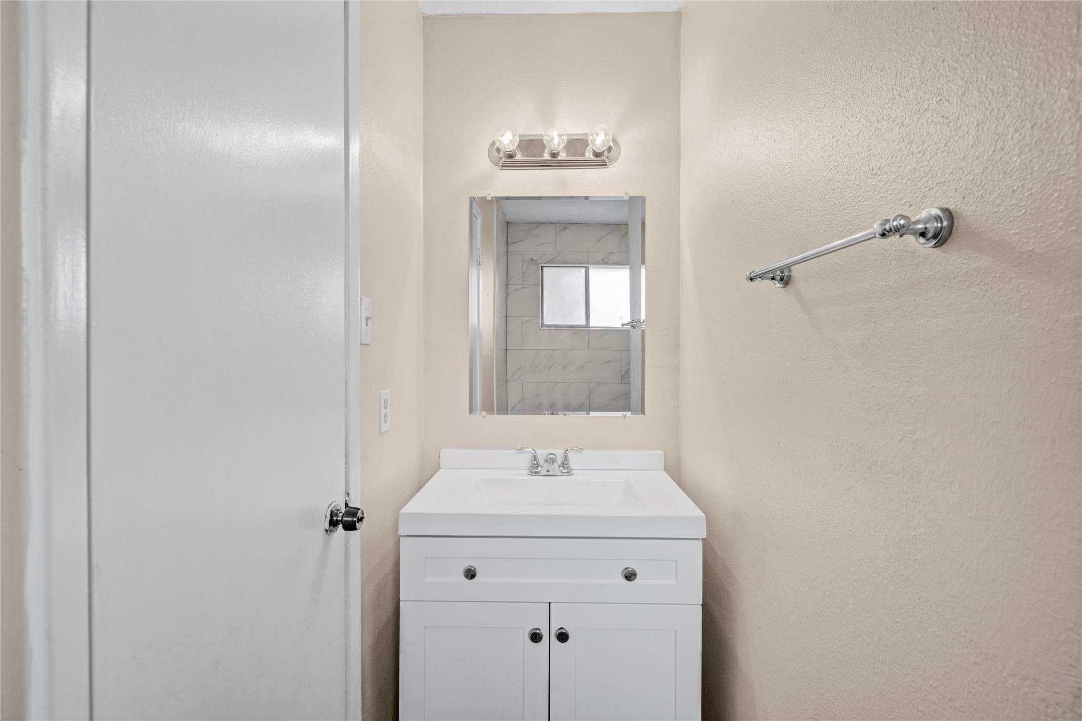 1230 Epsilon Street Pasadena, TX 77504 - Photo 15 of 27 a bathroom with a sink and a mirror