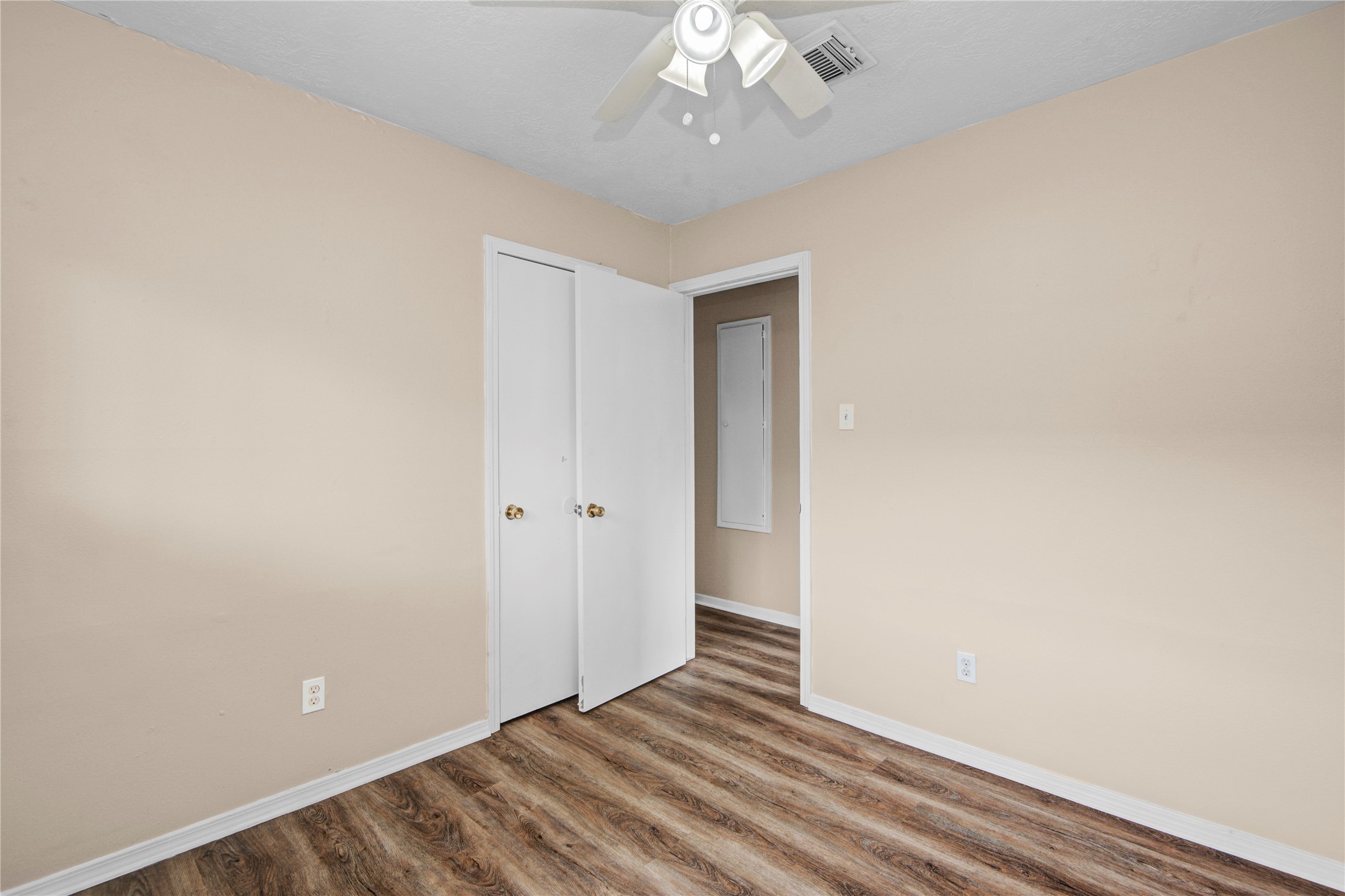 1230 Epsilon Street Pasadena, TX 77504 - Photo 20 of 27 a view of an empty room with wooden floor