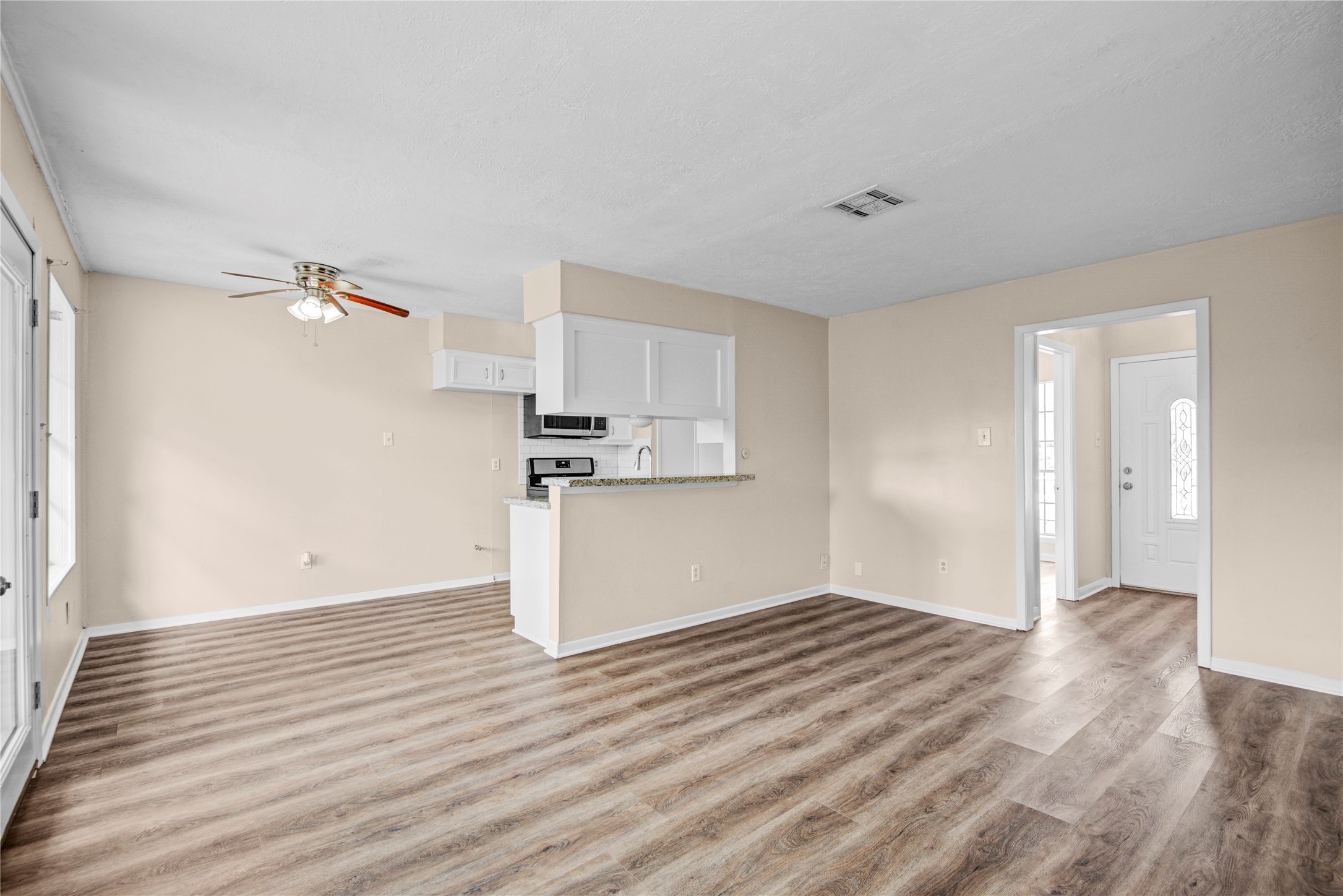 1230 Epsilon Street Pasadena, TX 77504 - Photo 9 of 27 a view of a kitchen with wooden floor