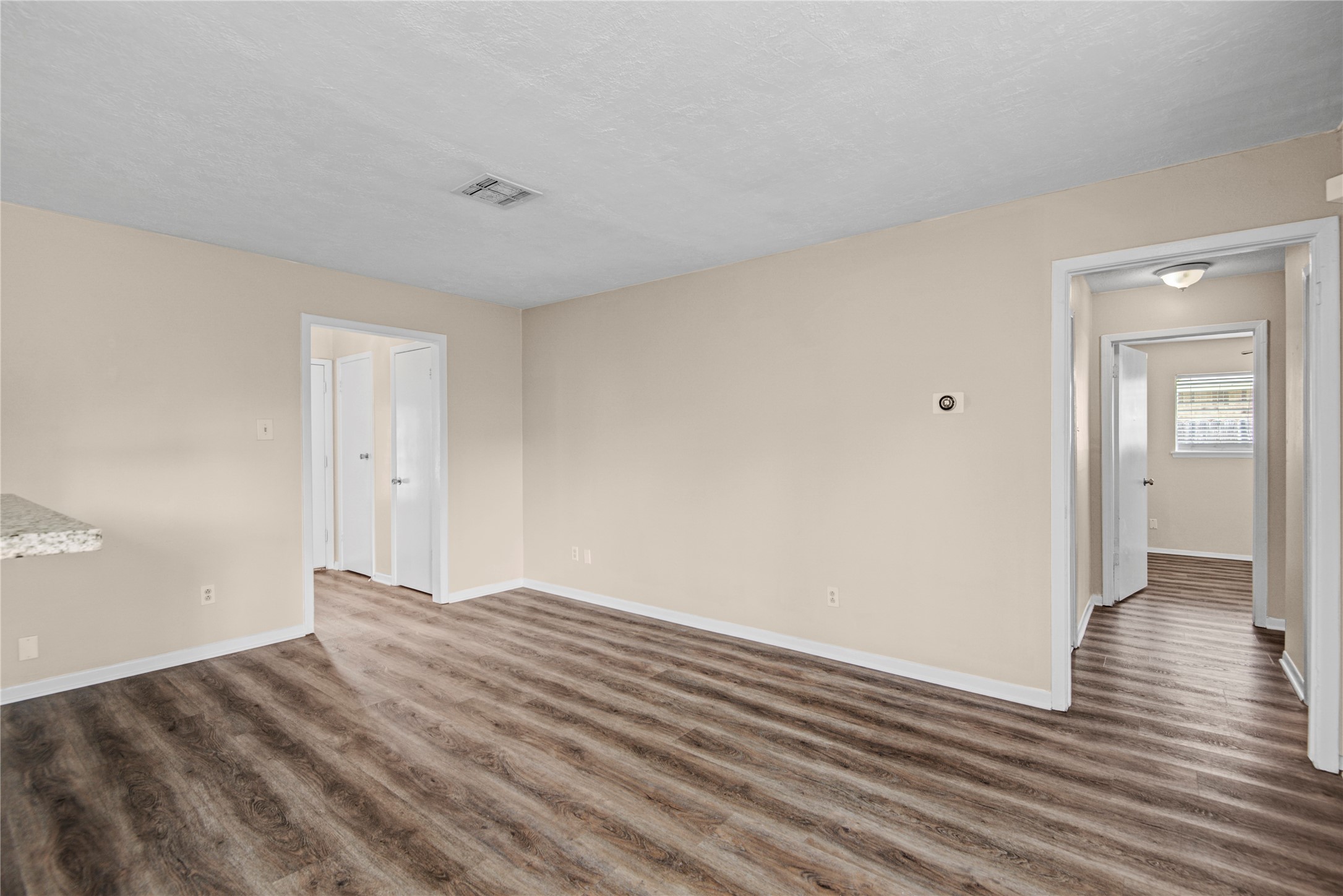 1230 Epsilon Street Pasadena, TX 77504 - Photo 10 of 27 a view of empty room with wooden floor