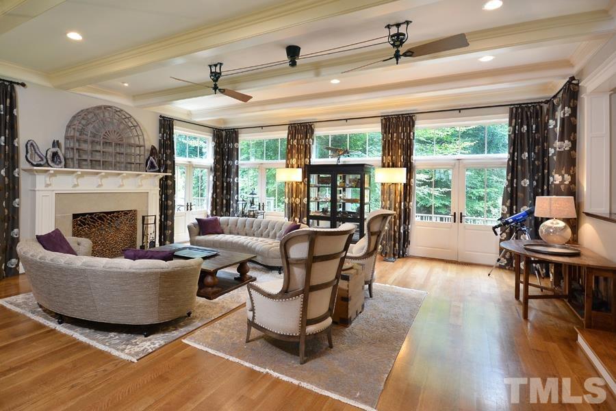 7 Springhouse Place Durham, NC 27705 - Photo 14 of 30 a living room with furniture and a fireplace