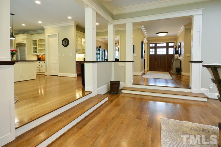 7 Springhouse Place Durham, NC 27705 - Photo 15 of 30 a view of a living room and kitchen with a large window