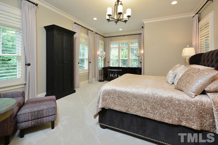 7 Springhouse Place Durham, NC 27705 - Photo 19 of 30 a bedroom with a large bed and window