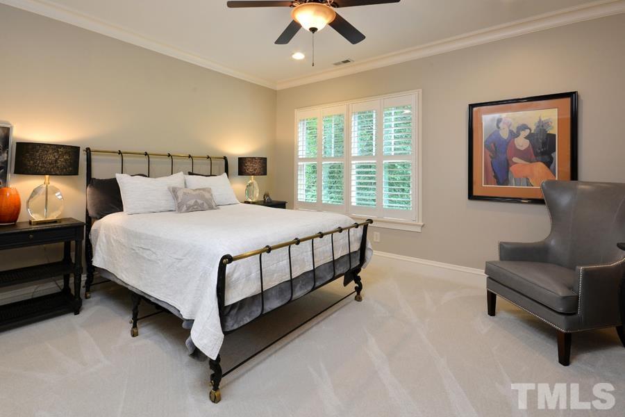 7 Springhouse Place Durham, NC 27705 - Photo 24 of 30 a bedroom with a bed couch and window