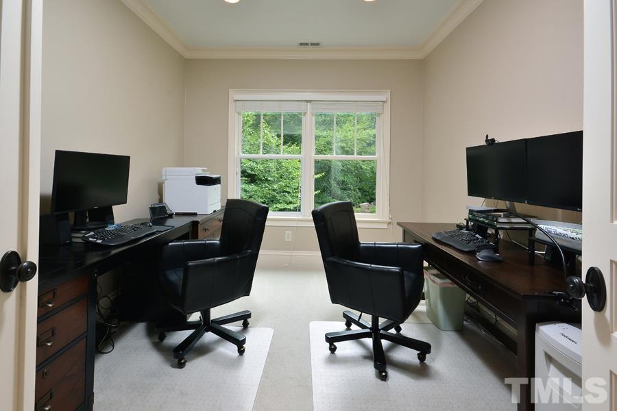 7 Springhouse Place Durham, NC 27705 - Photo 29 of 30 a view of a workspace with furniture and a window