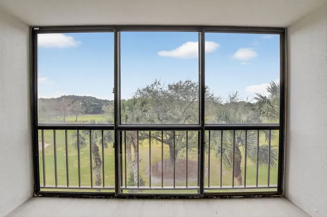 a view of a glass door and a balcony