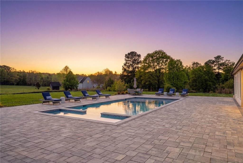 3215 Indian Shoals Road Dacula, GA 30019 - Photo 17 of 18 a view of a swimming pool with a yard