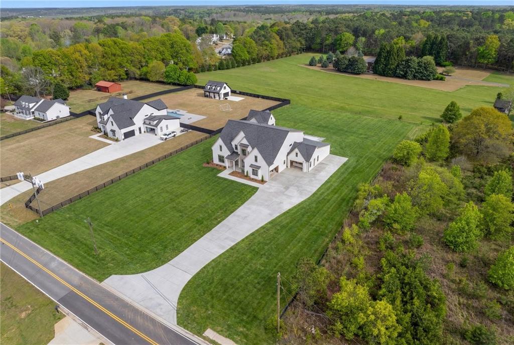 3215 Indian Shoals Road Dacula, GA 30019 - Photo 7 of 18 an aerial view of a house with a garden