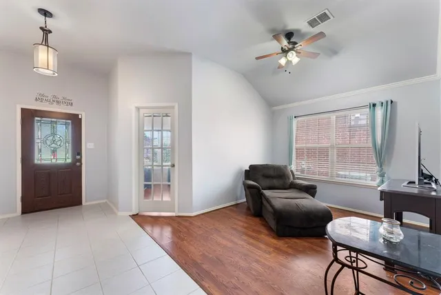 a living room with furniture and window