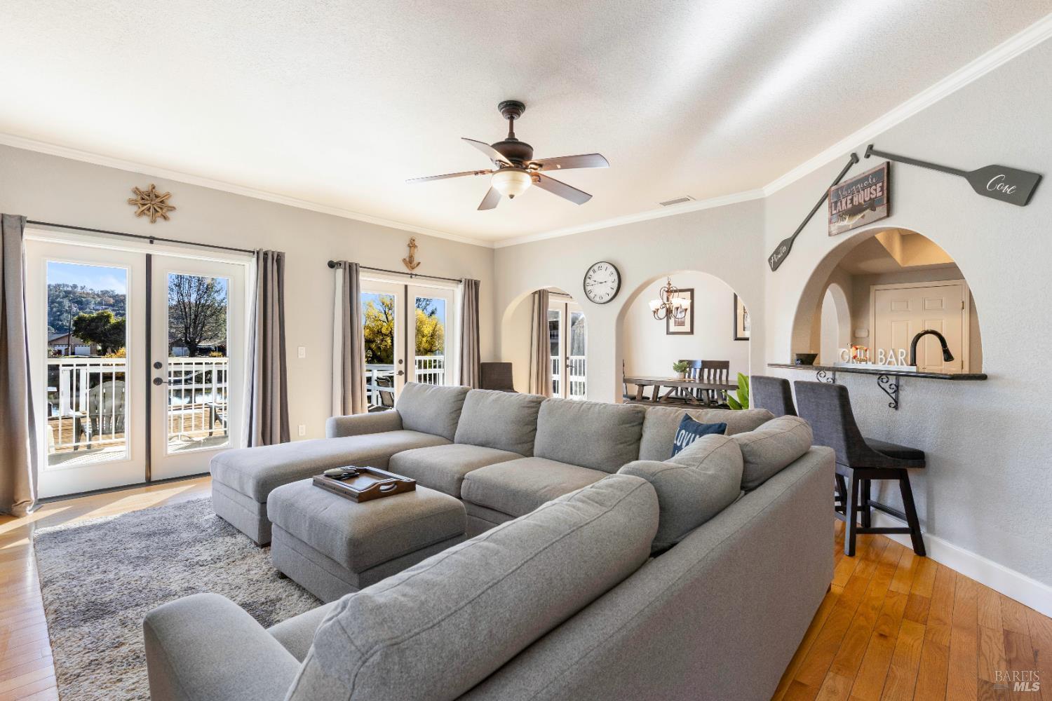 11115 Lakeshore Drive Clearlake, CA 95422 - Photo 13 of 69 a living room with furniture a ceiling fan and a rug