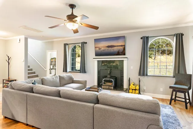 a bedroom with a large bed and a flat tv screen