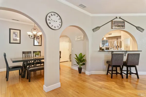 a kitchen with stainless steel appliances granite countertop a sink a stove and cabinets