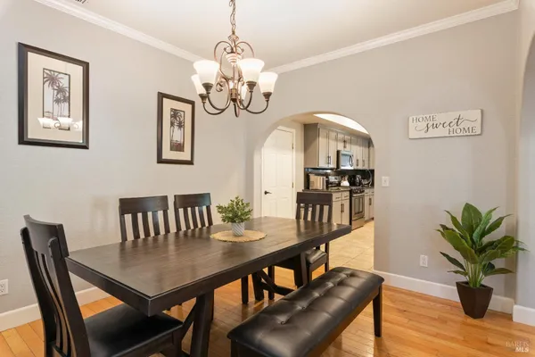 a kitchen with granite countertop cabinets stove top oven and microwave