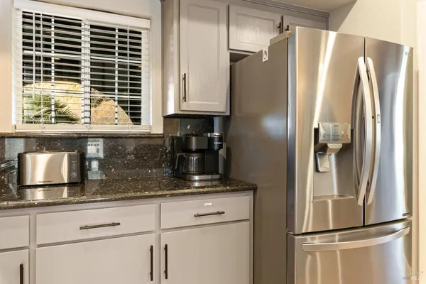 a view of a hallway and a livingroom with wooden floor