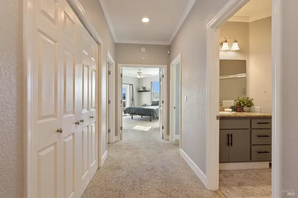 a bathroom with a granite countertop double vanity sinks and a mirror