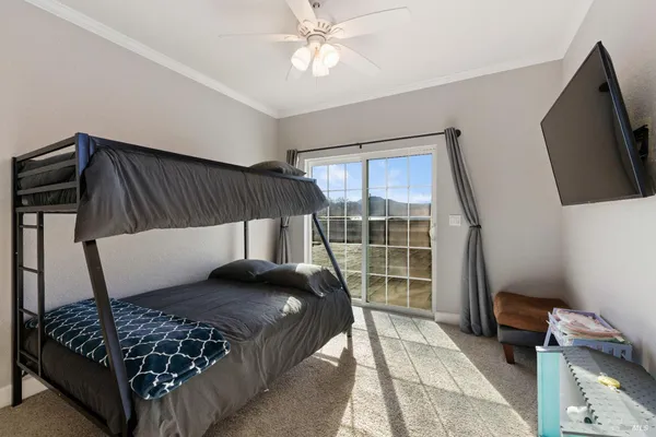 a bedroom with a bed and window