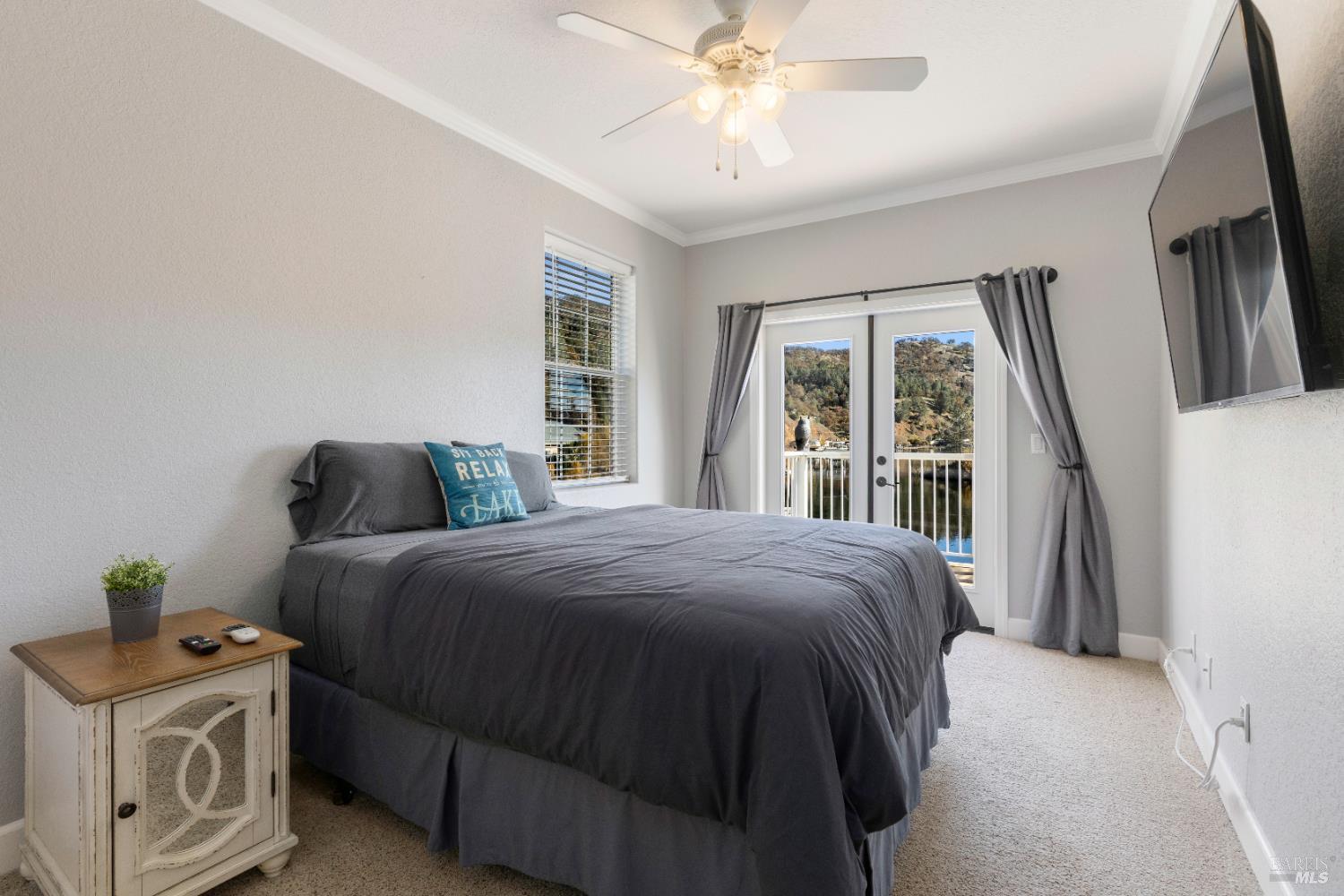 11115 Lakeshore Drive Clearlake, CA 95422 - Photo 39 of 69 a bedroom with a bed and a window