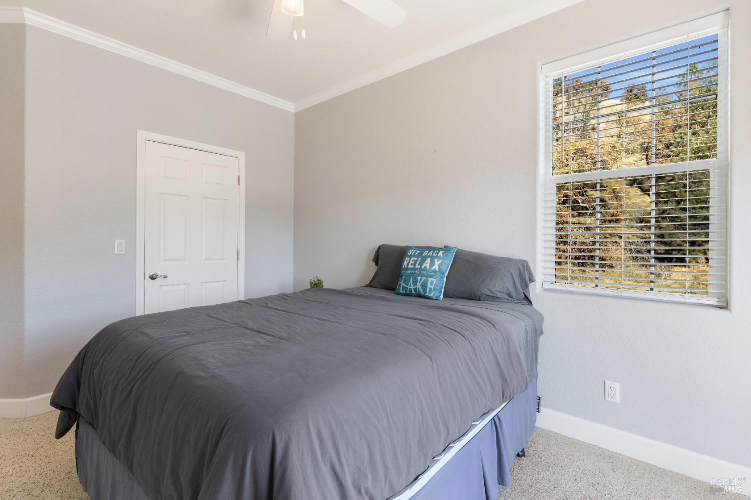 11115 Lakeshore Drive Clearlake, CA 95422 - Photo 40 of 69 a bedroom with a bed and window