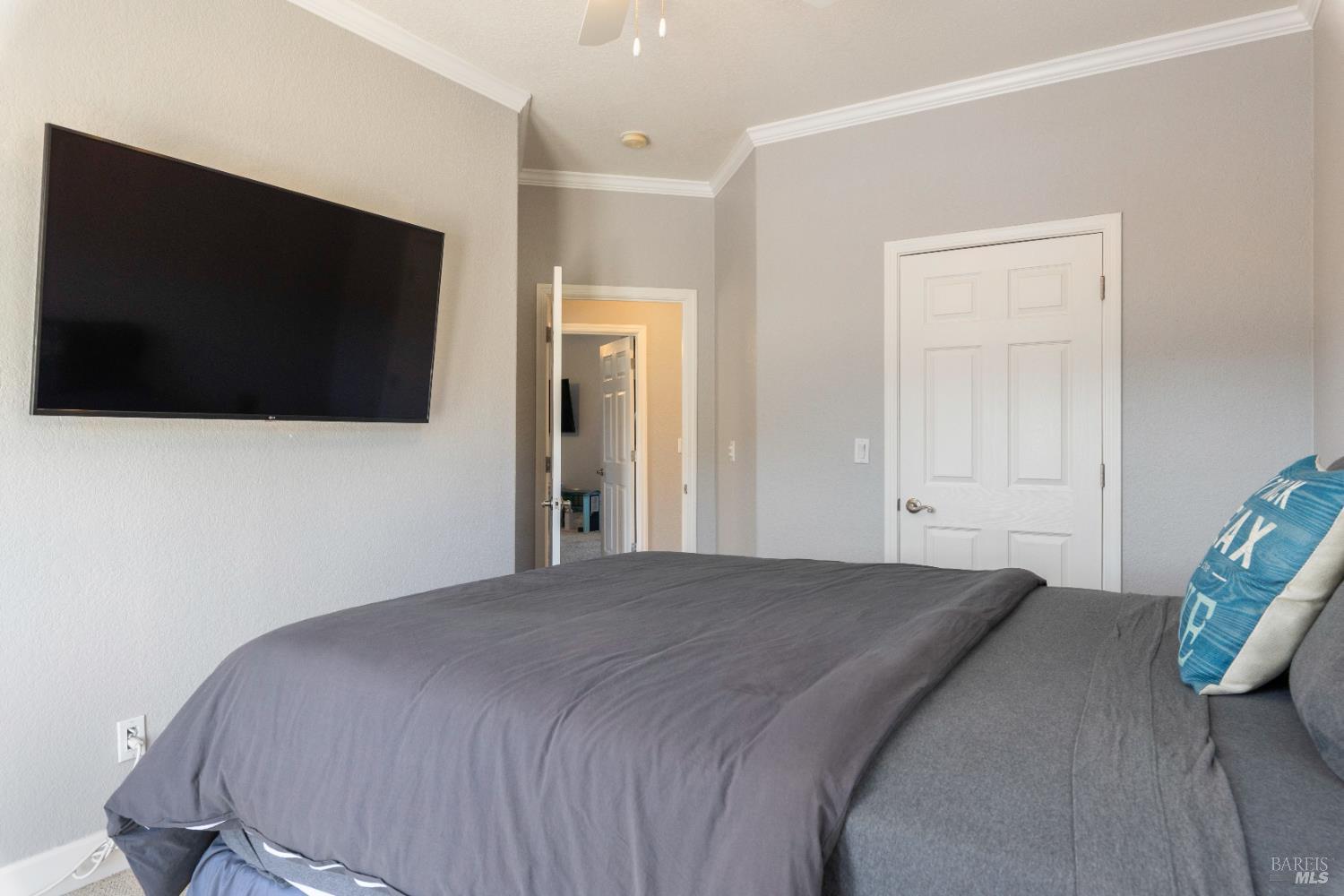 11115 Lakeshore Drive Clearlake, CA 95422 - Photo 41 of 69 a bedroom with a flat screen tv and a bed