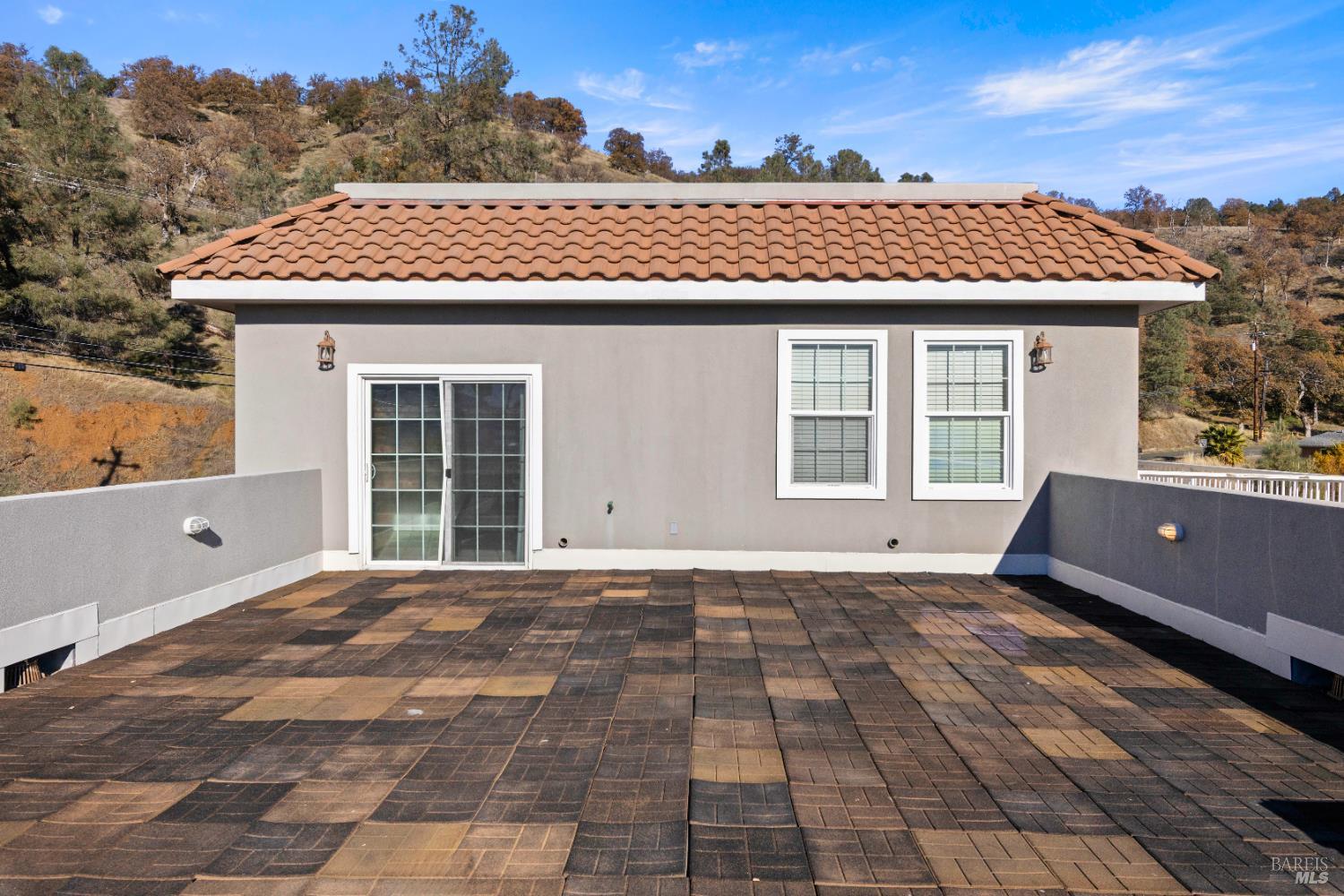11115 Lakeshore Drive Clearlake, CA 95422 - Photo 45 of 69 a view of a brick house with many windows