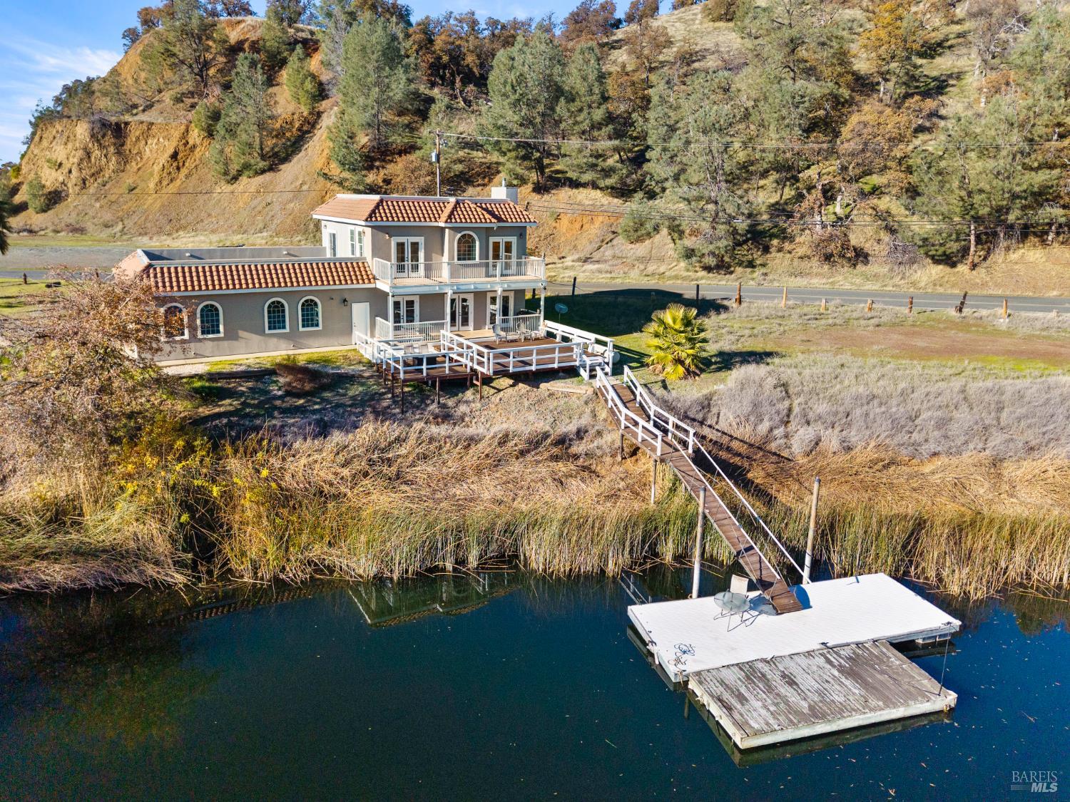 11115 Lakeshore Drive Clearlake, CA 95422 - Photo 57 of 69 a view of a house with a yard and sitting area