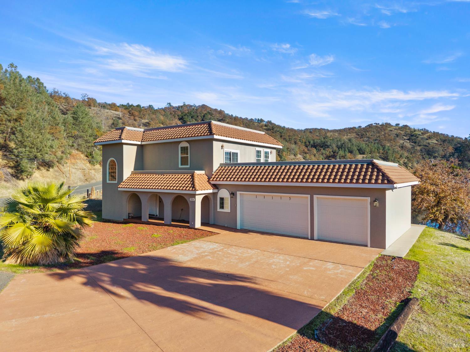 11115 Lakeshore Drive Clearlake, CA 95422 - Photo 7 of 69 front view of a house with a garden