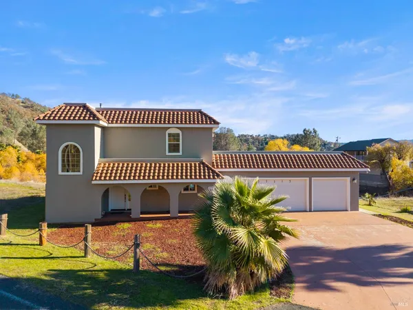 a living room with furniture ceiling fan and a flat screen tv