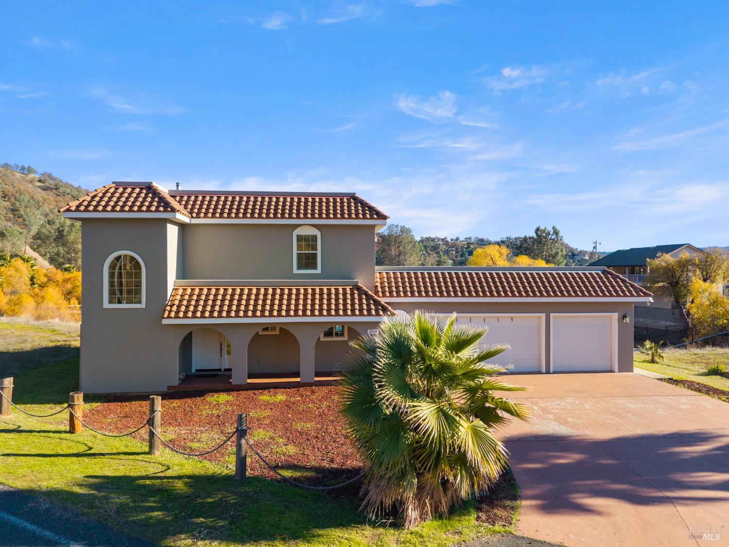 11115 Lakeshore Drive Clearlake, CA 95422 - Photo 8 of 69 a front view of a house with a yard